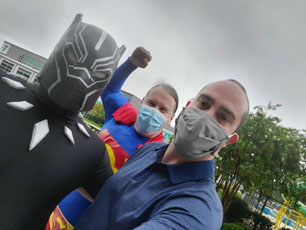 PEP Board Member, John Lamprecht, poses with masked superheroes at the Fit 4 School event.