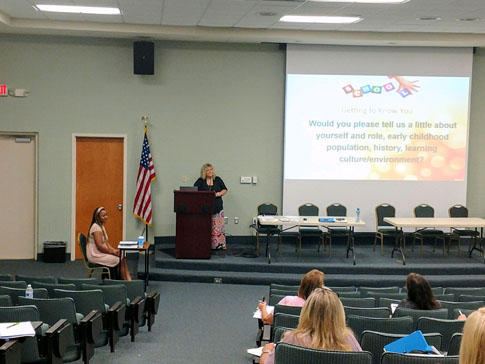 Guest speakers Paige Leopard, Early Learning Director at ACPSD, and Tina Shaw from the SC State Dept. Office of Assessment address Aiken County 4K teachers.